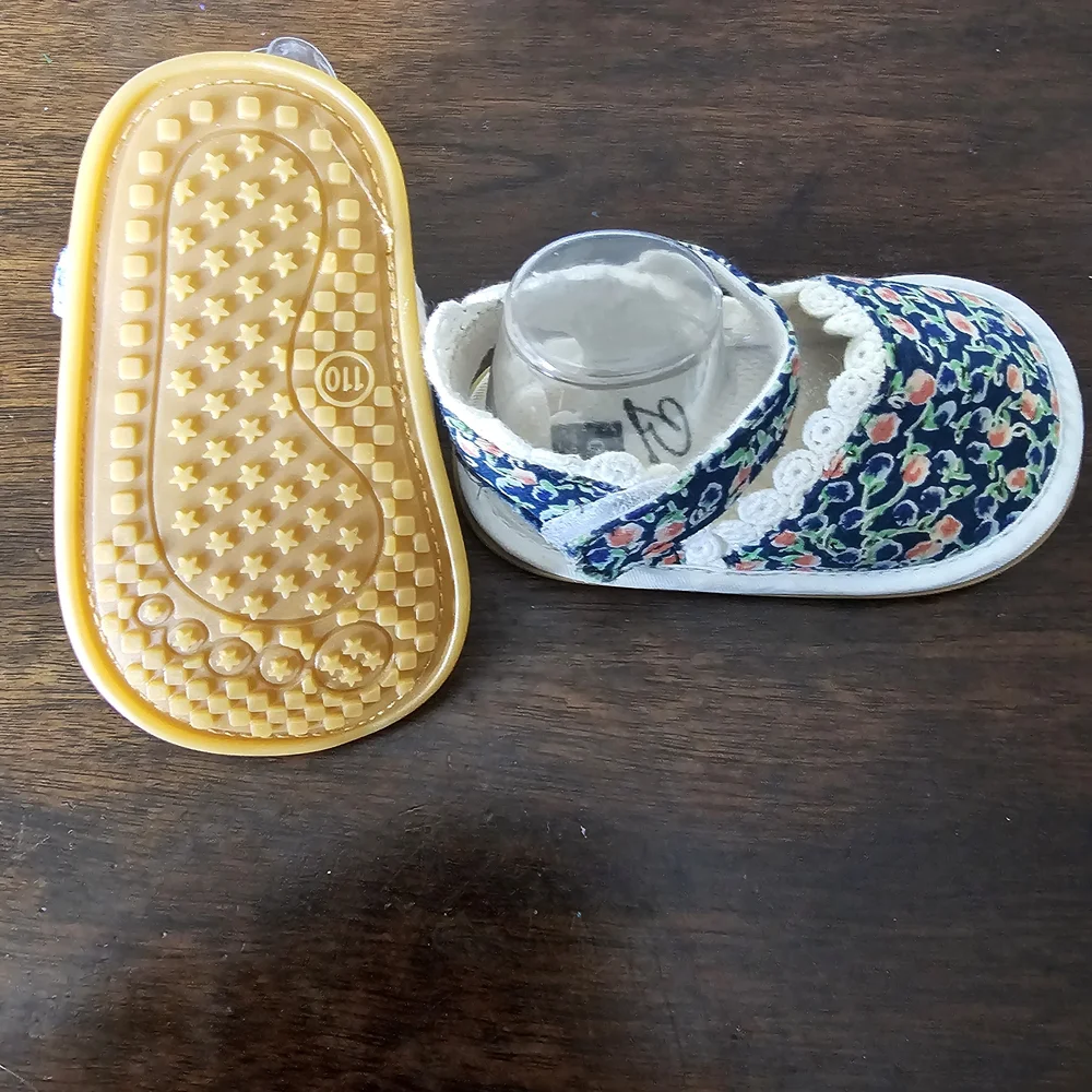 3 pairs of baby/girl shoes—soft, floral, and glittery—in various styles.